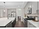 Modern kitchen with stainless steel appliances, a gas range, and a large center island at 4195 Island Fox Ln, Denver, NC 28037