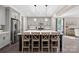 Spacious kitchen with gray cabinets, stainless steel appliances, and a center island with seating at 4195 Island Fox Ln, Denver, NC 28037