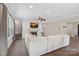 Bright living room with a fireplace, hardwood floors, and comfortable seating at 4195 Island Fox Ln, Denver, NC 28037