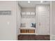 Mudroom with a built-in bench, storage baskets, and hooks for organization at 4195 Island Fox Ln, Denver, NC 28037