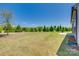 Large backyard featuring mature trees and a well-manicured lawn at 4502 Middlebury Ln, Fort Mill, SC 29715