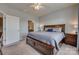 Spacious bedroom with plush carpet, a large bed, and an ensuite bathroom at 4502 Middlebury Ln, Fort Mill, SC 29715
