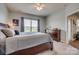 Well-lit bedroom features large window, ceiling fan, and is warmly decorated at 4502 Middlebury Ln, Fort Mill, SC 29715