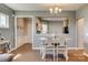 Charming dining area features a stylish table, open to kitchen, and neutral decor at 4502 Middlebury Ln, Fort Mill, SC 29715