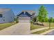 Charming blue home with a well-manicured front lawn and a two-car garage at 4502 Middlebury Ln, Fort Mill, SC 29715