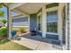 Inviting front porch features a cozy chair, plants, and a 'Welcome' mat at 4502 Middlebury Ln, Fort Mill, SC 29715
