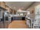 Bright kitchen boasts stainless appliances, dark wood cabinets, and an adjacent dining area at 4502 Middlebury Ln, Fort Mill, SC 29715