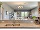 Granite countertops and undermount sink offer view to an open living space at 4502 Middlebury Ln, Fort Mill, SC 29715