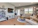 Stylish living room featuring hardwood floors, a large TV, and comfortable seating at 4502 Middlebury Ln, Fort Mill, SC 29715