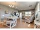 Open-concept living room and dining area featuring hardwood floors and ample natural light at 4502 Middlebury Ln, Fort Mill, SC 29715
