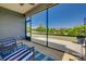 This screened-in patio has comfortable rocking chairs, and a fan, with an open backyard at 4502 Middlebury Ln, Fort Mill, SC 29715