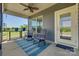 Relaxing screened-in patio with comfortable seating, ceiling fan, and a serene backyard view at 4502 Middlebury Ln, Fort Mill, SC 29715