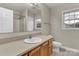 Bathroom with vanity, sink, toilet, and mirror provides essential functionality and comfort at 4773 Westwinds Rd, Lincolnton, NC 28092