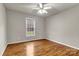 Bedroom featuring a ceiling fan, hardwood floors, and a window creates a relaxing atmosphere at 4773 Westwinds Rd, Lincolnton, NC 28092