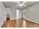The bedroom boasts hardwood floors and a ceiling fan for comfortable and stylish living at 4773 Westwinds Rd, Lincolnton, NC 28092
