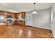 Open kitchen with stainless steel appliances, wood cabinets, and hardwood floors, ideal for cooking and entertaining at 4773 Westwinds Rd, Lincolnton, NC 28092