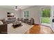 Cozy living room featuring hardwood floors, comfortable seating, and an abundance of natural light at 4773 Westwinds Rd, Lincolnton, NC 28092