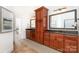 Bathroom features dual sinks with wood cabinets and granite countertops at 4904 Ardenetti Ct, Mint Hill, NC 28227