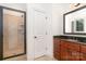 Bright bathroom featuring a glass enclosed shower and wood vanity with granite countertop at 4904 Ardenetti Ct, Mint Hill, NC 28227