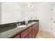 Bright bathroom with double sink vanity, granite countertops, and large mirror at 4904 Ardenetti Ct, Mint Hill, NC 28227