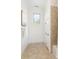 Bright bathroom featuring neutral tile flooring and shower and a linen closet at 4904 Ardenetti Ct, Mint Hill, NC 28227