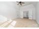 Bright bedroom featuring high ceilings and double french doors at 4904 Ardenetti Ct, Mint Hill, NC 28227