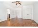 Empty bedroom with hardwood floors, a ceiling fan, and an ensuite bath at 4904 Ardenetti Ct, Mint Hill, NC 28227