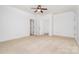 Bedroom with neutral carpet, crown molding, and access to adjoining rooms through paneled doors at 4904 Ardenetti Ct, Mint Hill, NC 28227