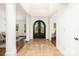 Elegant foyer with tile flooring, a decorative front door, and views into the dining and living spaces at 4904 Ardenetti Ct, Mint Hill, NC 28227