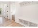 Bright hallway featuring a built-in bench, storage cubbies and coat hooks at 4904 Ardenetti Ct, Mint Hill, NC 28227