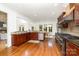 Spacious kitchen features stainless steel appliances, dark wood cabinets, granite countertops and hardwood floors at 4904 Ardenetti Ct, Mint Hill, NC 28227