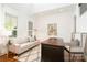 Bright office space with large windows, hardwood floors, a desk and couch at 4904 Ardenetti Ct, Mint Hill, NC 28227