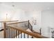 Staircase with wooden railing and stairs and neutral colored carpet at 4904 Ardenetti Ct, Mint Hill, NC 28227