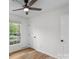 Bedroom with wood flooring, ceiling fan, and window at 4932 Delivau Dr, Charlotte, NC 28215