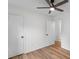 Bright bedroom with wood floors and two white doors at 4932 Delivau Dr, Charlotte, NC 28215