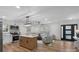 Bright open-concept living space boasts an island kitchen and modern furnishings at 4932 Delivau Dr, Charlotte, NC 28215
