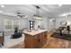 Bright open-concept living space boasts wood floors and modern furnishings at 4932 Delivau Dr, Charlotte, NC 28215