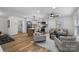 Spacious open-concept design seamlessly blends kitchen and living areas at 4932 Delivau Dr, Charlotte, NC 28215