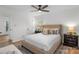 Serene primary bedroom featuring a plush king bed, soft colors and ceiling fan at 4932 Delivau Dr, Charlotte, NC 28215