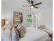 Calm primary bedroom featuring a bench, soft colors and ceiling fan at 4932 Delivau Dr, Charlotte, NC 28215