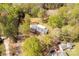 Home surrounded by mature trees and lush greenery at 605 Ottawa Dr, Rock Hill, SC 29732