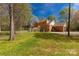 Rear view of brick home featuring a fenced backyard and a wooden deck at 605 Ottawa Dr, Rock Hill, SC 29732