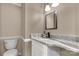 Bathroom with marble countertops, modern faucet and lighting fixtures at 605 Ottawa Dr, Rock Hill, SC 29732