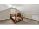 Bedroom with a sloped ceiling, natural light from a window and painted white at 605 Ottawa Dr, Rock Hill, SC 29732
