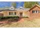 Charming home with a brick walkway, manicured landscaping, and dormer windows at 605 Ottawa Dr, Rock Hill, SC 29732