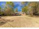 Ranch-style home showcasing a spacious front yard and traditional brick and siding exterior at 605 Ottawa Dr, Rock Hill, SC 29732