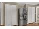 Stainless steel refrigerator is flanked by storage in this bright kitchen at 605 Ottawa Dr, Rock Hill, SC 29732