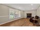 Sunlit living room with fireplace, large window, and hardwood floors at 605 Ottawa Dr, Rock Hill, SC 29732