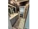 Modern bathroom featuring double sinks, a framed mirror, and a decorative sliding door at 6499 Gopher Rd, Lancaster, SC 29720