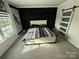 Bright bedroom with large bed, modern decor, carpet flooring, and bright window at 6499 Gopher Rd, Lancaster, SC 29720